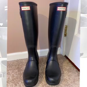 Tall black hunter boots